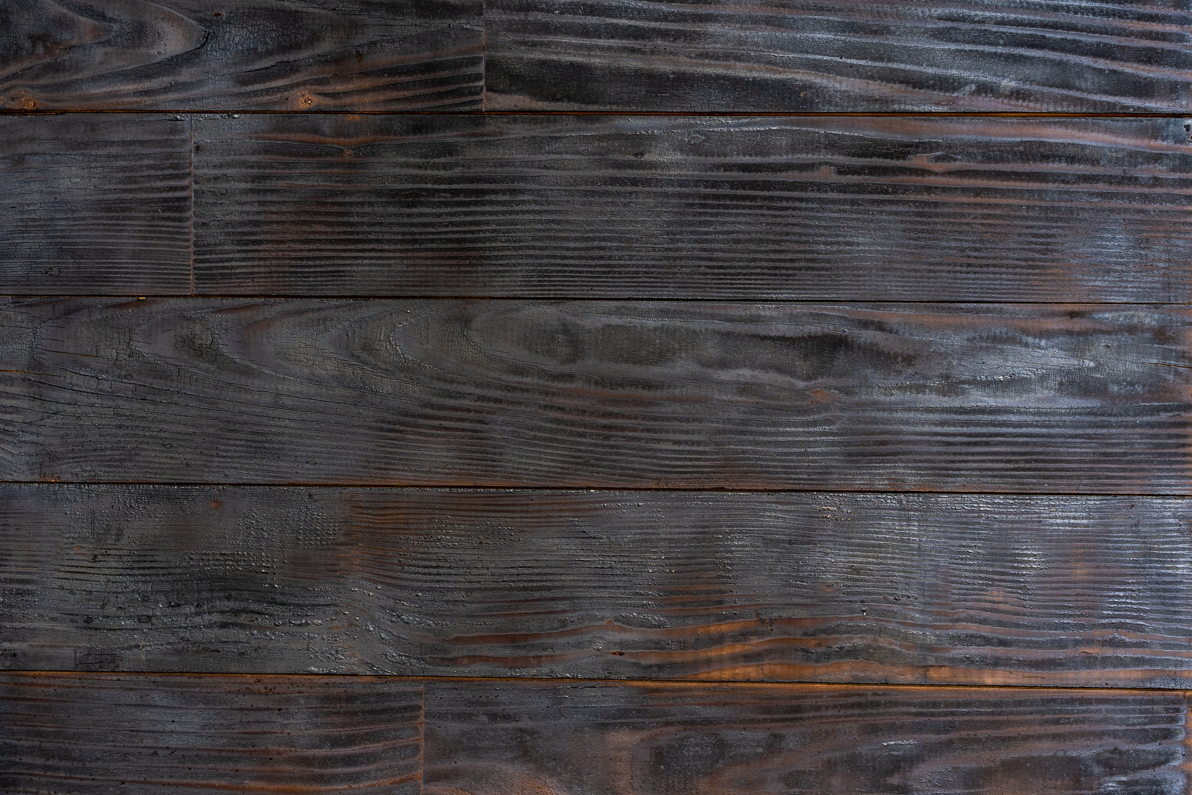 BBQ background. Burnt wooden Board texture. Burned scratched hardwood surface.